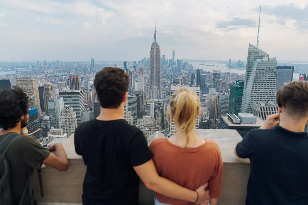 Tourists admire the view of the Empire State Building from Top of the Rock